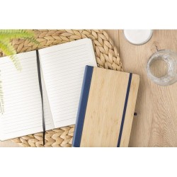 Carnet A5 Éco-responsable en Bambou et PU - Dorita Matières : polyester Couleurs : blanc personnalisable avec votre logo